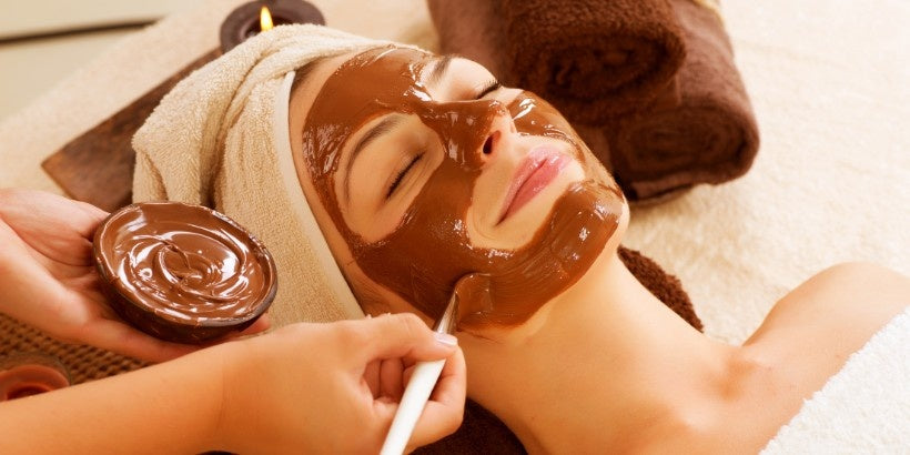 A woman doing Ayurvedic Beauty Therapy to nourish her skin at Sevayu Canada 